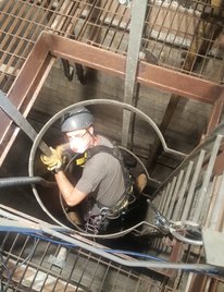 brave rope access technician working in confined space